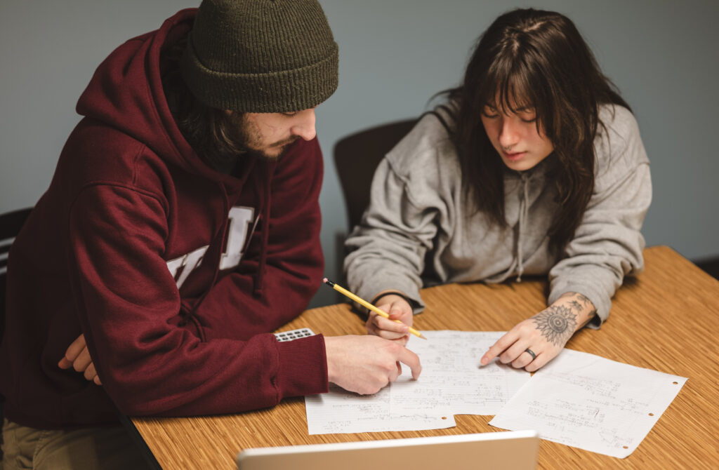 A Rising Stars tutor listening to a student during a session